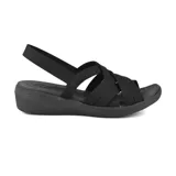 Sandalia Skechers Arya True Calling color negro, con tiras elásticas cruzadas en el empeine y tira trasera en el talón. Cuenta con plantilla acolchada Luxe Foam® y tacón de cuña de 1 1/2 pulgada.