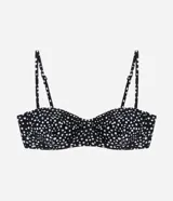 Top de bikini negro con estampado de lunares blancos, corte media taza con breteles ajustables y lazo en la espalda. Confeccionado en microfibra.