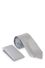 Corbata verde oscuro con estampado floral y pañuelo de bolsillo a juego.