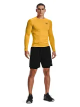 Short de compresión Under Armour de la línea HeatGear, diseñado para entrenamiento de alto rendimiento. Presenta un ajuste ceñido al cuerpo, cintura elástica ancha con logo de la marca, bolsillo lateral y logo reflectante en la pierna derecha.