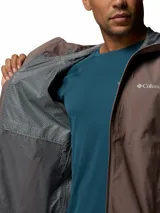 Campera cortaviento impermeable y transpirable Columbia Trailborne 2.5L color marrón, con capucha integrada, cierre frontal bidireccional y bolsillos con cierre.