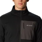 Campera de polar Columbia Hike Full, color negro con bolsillo gris en el pecho y cierre frontal.