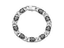 Pulsera de acero plateado con eslabones tipo cadena y apliques con diseño de flor de liz.