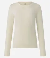 Blusa de manga larga con cuello redondo, confeccionada en una mezcla de algodón y elastano. Presenta un diseño básico, ajustado y liso, ideal para uso diario.