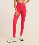 Calza deportiva larga de microfibra color fucsia, con cintura alta y bolsillo lateral.