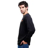 Remera de manga larga Volcom color negro, con cuello redondo y pequeño estampado de un águila en el pecho.