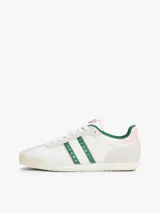 Zapatillas deportivas Tommy Jeans de estilo retro, color blanco con detalles en verde y rosa. Confeccionadas en poliéster con paneles de texturas mixtas, logo de la marca en el lateral y suela de goma.