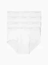 Pack de cuatro slips blancos de algodón con cintura elástica gris con el logo de Calvin Klein.