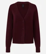 Cardigan de punto color bordó, con cuello en V, cierre frontal con botones al tono y mangas largas. Presenta puños y ruedo acanalados.