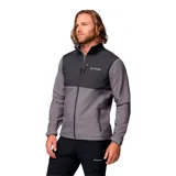Campera cortaviento Columbia modelo Ascender, confeccionada en tejido softshell con tecnología Omni-Shield repelente al agua. Presenta diseño bicolor en tonos gris y grafito, cuello alto con protector de mentón, cierre frontal completo, bolsillos laterales y en el pecho con cremallera, y puños ajustables.