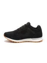 Championes Caterpillar modelo Ventura para mujer, de color negro con suela de goma caramelo y entresuela blanca. Confeccionados con capellada de gamuza y lona, cordones negros y el logo de la marca impreso en el lateral y la lengüeta.