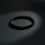 Pulsera de eslabones tipo reloj, fabricada en acero con acabado negro mate.