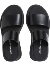 Sandalias tipo slide Calvin Klein de cuero negro con doble tira y plataforma.