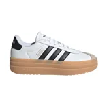 Championes adidas VL Court Bold con diseño de plataforma, capellada de cuero sintético blanco, las icónicas tres tiras laterales en negro y suela de goma color caramelo.