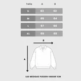 Buzo tipo polo de algodón, con diseño de bloques de color negro y blanco, cuello camisero y logo estampado en el pecho.
