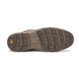 Zapato de cuero color marrón oscuro con cierre de cordones, diseño de costuras reforzadas y suela de goma dentada en tono tierra.
