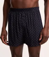 Calzoncillo tipo boxer de tela confeccionada en viscosa, con cintura elástica y estampa de mini losangos coloridos.