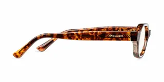 Lentes con protección contra luz azul y UV400, con montura de diseño ovalado en estampado carey y lentes transparentes.
