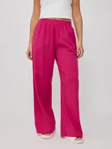 Pantalon de corte recto y holgado, confeccionado en una mezcla de algodón y lino. Presenta cintura elástica con frunces y un diseño de color liso.