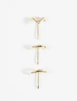 Set de tres horquillas doradas de metal con diseño ondulado.