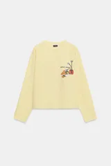 Camiseta de manga larga ranglán y cuello redondo, color amarillo, con estampado frontal a contraste.