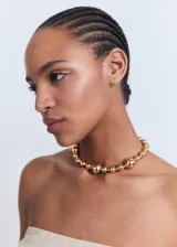 Top strapless de algodón con diseño entallado, fruncidos laterales y cierre de cremallera lateral.