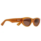 Lentes de sol Indie modelo Nápoles, con montura color ámbar y lentes marrones polarizadas.