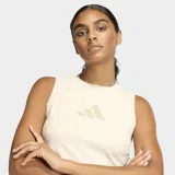 Musculosa deportiva Adidas línea Z.N.E. de corte ajustado, color beige claro, con cuello redondo y logo de la marca estampado en el pecho en tono a juego.