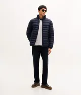 Campera puffer ultraligera Marfinno color negro, con cuello alto, cierre frontal por cremallera y bolsillos laterales.