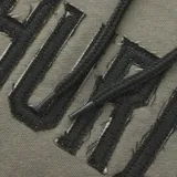 Buzo con capucha color ladrillo, con cordones negros y logo Hurley estampado en el frente.