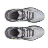 Championes de entrenamiento Under Armour modelo Charged Commit Tr 5, color gris con detalles en verde neón. Presentan una estructura robusta con entresuela Charged Cushioning para mayor amortiguación y suela de goma con diseño de alta tracción.