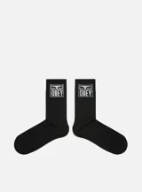 Medias de largo medio color blanco con el logo de Obey tejido en la parte superior.