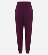 Pantalón tipo jogger de mujer, confeccionado en tejido modal con mezcla de poliéster y elastano. Presenta cintura elástica con lazo de ajuste, bolsillos laterales y puños elásticos en el ruedo.
