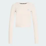 Remera de running Adidas de manga larga, color beige, con corte entallado y largo por encima de la cintura. Presenta cuello redondo, aberturas para los pulgares en los puños y logo reflectante de la marca en el pecho. Confeccionada con tecnología Climacool para absorción de sudor.