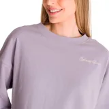 Buzo lila de mujer, marca Caterpillar, confeccionado en tejido de rizo francés (70% algodón, 30% poliéster). Tiene cuello redondo, puños y cintura de punto elástico. Presenta un bordado de una oruga en el pecho y un parche bordado con el logo de Cat en la parte inferior de la manga.