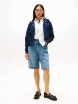 Buzo con capucha y cierre frontal de Tommy Hilfiger, color azul marino, con logo bordado en el pecho. Confeccionado en piqué de mezcla de algodón y nailon, con puños y bajo de punto canalé, y bolsillos tipo canguro.