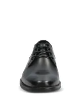 Zapato de vestir formal Hush Puppies modelo Blues, confeccionado en cuero negro con cierre de cordones. Presenta una silueta clásica con puntera redondeada y suela de goma resistente.