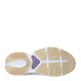 Championes New Balance modelo Training Cat, color beige y blanco con detalles en lila y plateado. Presentan una suela gruesa y un diseño de malla transpirable.