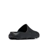 Sandalia tipo slide Columbia modelo Thrive Revive, color negro, diseñada para recuperación con entresuela de espuma ligera y suave. Presenta aberturas laterales para ventilación, plantilla hexagonal texturizada y suela de alta tracción para condiciones húmedas y secas.