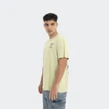 Remera verde de corte holgado con logo Reef estampado en el pecho.