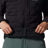 Campera puffer negra para hombre con tecnología Stretchdown™, diseñada con una tela elástica que integra bolsillos de aislamiento de plumón. Cuenta con cierre frontal bidireccional, bolsillos con cremallera en el pecho y laterales, puños elásticos y dobladillo ajustable.