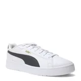 Championes Puma Court Classico, color blanco con franja lateral y detalles en negro, y logo Puma en dorado.
