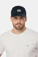 Gorro con visera azul de lona con parche frontal con logo Legacy & Co.