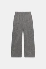 Pantalón gris melange de tiro alto y pierna ancha, con cintura elástica y bolsillos delanteros.