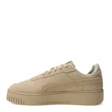 Championes Puma modelo Carina Street SD con diseño de plataforma, confeccionados en una combinación de cuero y gamuza en tono beige. Presentan perforaciones en la puntera, cierre con cordones y suela de goma robusta con logo grabado en el talón.