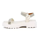 Sandalia Vizzano de plataforma chunky color beige con suela dentada. Cuenta con una tira delantera fina y una tira ancha en el empeine con cierre ajustable, ambas decoradas con pedrería brillante.
