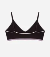 Soutien tipo bralette de diseño seamless en color marrón oscuro, con ribetes en contraste color blanco y banda inferior en color lila. Presenta copas desmontables y breteles finos ajustables.