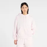 Canguro New Balance de dama, confeccionado en tejido French Terry suave, liviano y transpirable. Presenta diseño con capucha, cordones ajustables, bolsillo frontal tipo canguro y puños acanalados.