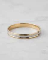 Pulsera esclava rígida de plata 925 y lámina de oro 18k, con diseño bicolor y pavé de circonias en la franja central.