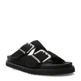 Sandalias Miss Carol Mura de color negro, con dos tiras anchas adornadas con grandes hebillas plateadas y suela plana dentada.
